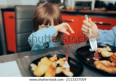 
Toddler Girl Refusing to Eat Lunch at Home. Little child rejecting hating bad boring food option for lunch
