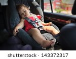 Toddler girl sleeping in child car seat.