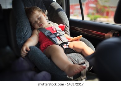 Toddler Girl Sleeping In Child Car Seat.