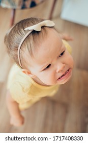 Toddler Girl Standing Alone With Angry Face Expression And Frowning