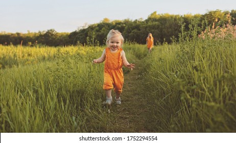 Toddler girl walking outdoor with mother family vacations child traveling eco tourism happy smiling emotions summer season nature                                                - Powered by Shutterstock