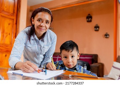 Toddler Learning To Paint With Crayons With Her Mom - Hispanic Mother Teaching Her Young Son - Online Classes In Latin America