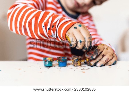 Similar – Baby Mädchen spielt mit Haarspangen, die auf dem Boden sitzen.