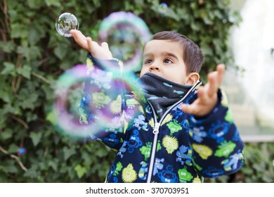 Toddler Playing With Bubbles