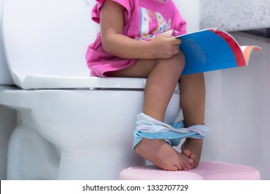 Toddler Sitting On The Toilet, Potty Training.