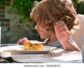 A Toddler Uses Self Control To Avoid Eating A Scone In Front Of Him