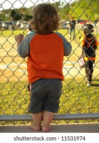 Toddler Watching Baseball Game.