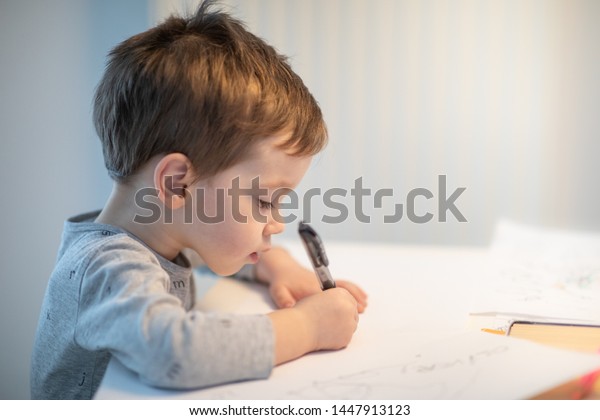 Toddler Writing On Blank Paper While Stock Photo Edit Now 1447913123