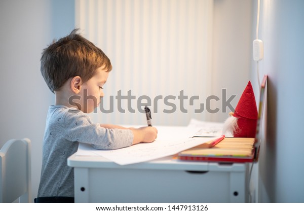 Toddler Writing On Blank Paper While Stock Photo Edit Now 1447913126