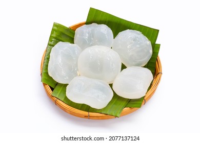 Toddy palm in round bamboo basket on white background.