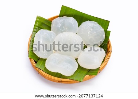 Toddy palm in round bamboo basket on white background.