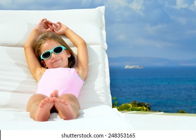 Todler Girl Relaxing On Sunbed