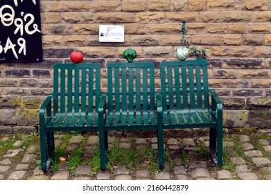 TODMORDEN. WEST YORKSHIRE. ENGLAND. 05-21-22.A vegetable decorated bench on the Rochdale Canal towpath at Lock 19.