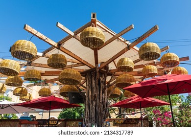 Todos Santos, Baja California Sur, Mexico. November 11, 2021. Woven Basket Lamps Hanging Over Tables At An Outdoor Cafe.