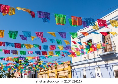 Todos Santos, Baja California Sur, Mexico. Festive colorful banners over a street in Todos Santos.