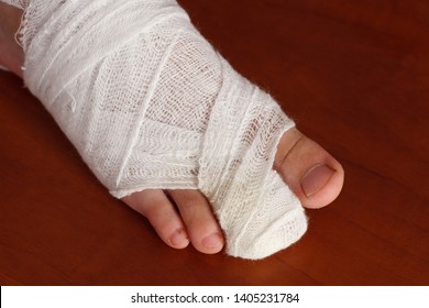 Toe Bandage - Young Boy Hurt His Foot With A Door At Home
