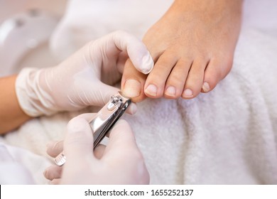 Toe Nails Cutting With Nail Clippers, Pedicure Concept