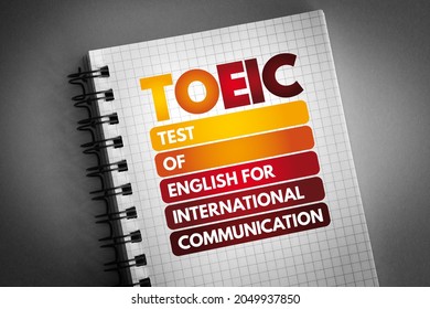 TOEIC - Test Of English For International Communication acronym on notepad, concept background