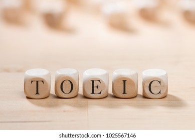 Toeic word on wooden cubes. Toeic concept