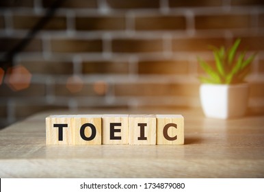 Toeic word on wooden cubes. Toeic concepts