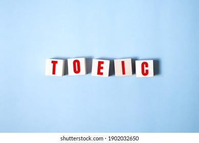 Toeic word on wooden cubes. Toeic concepts.