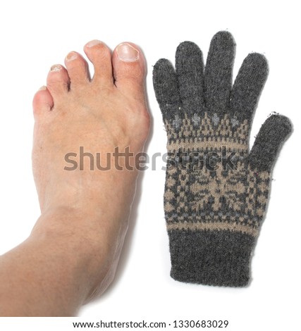Toes and wool socks on a white background.