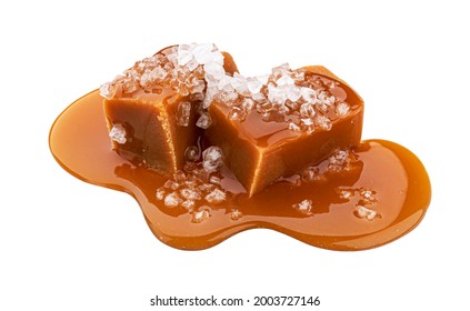 Toffee candies with melted caramel sauce and salt isolated on white background - Shutterstock ID 2003727146