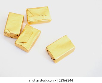 Toffee And Gold Wrapper Packaging On White Background