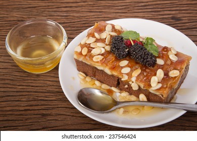  Toffee Nut Cakes On A Plate With Honey 