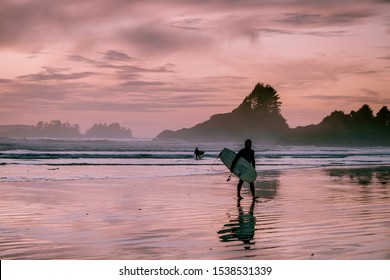 Tofino Vancouver Island Canada September 2019, surfers on the beach of Cox Bay during sunset , a popular surf spot at Tofino