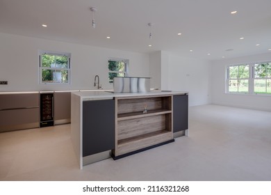 Toft, Cambridgeshire - September 18 2017: Brand New Luxury Kitchen With Built In Apliances And Cupboards Including Wine Fridge And Peninsular Unit Housing Hob