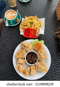 Tofu, French Fries, And Caffe Latte On Black Textured Table