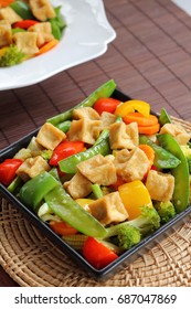 Tofu And Mixed Vegetable Stir Fried Wood Background.