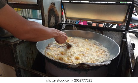 The Tofu Seller Is Frying Tofu In A Hot Oil Pan