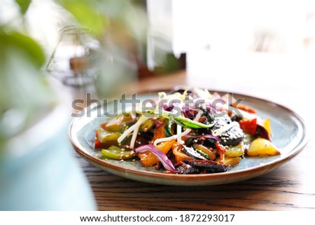 Tofu with vegetables. stir fry vegetables with pieces of tofu, coriander, cumin, cream and butter with a little soy sauce and oyster sauce - served with jasmine rice.
Appetizing dish, served on a plat