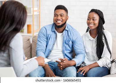 Together Again. Portrait Of Happy African American Couple Holding Hands After Reconciliation On Marital Therapy Session At Psychologist's Office.