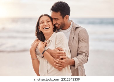 Together, beach and happiness with hug on holiday for having fun with sunset for the weekend. Couple, vacation and laughing with face at the ocean for travel in the summer for a relaxing time. - Powered by Shutterstock