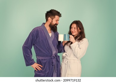 Together More Tasty. Coffee Is Our Tradition. Man And Woman Happy Together. Family Traditions. Couple In Cozy Bathrobes Enjoy Lazy Weekend. Drinking Coffee. Brewing Coffee At Home. Hot Drink