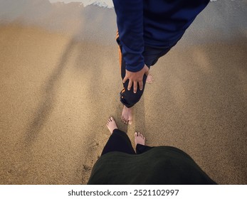 Togetherness on sandy beach, barefoot moment captured - Powered by Shutterstock