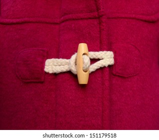 Toggle Button On A Red Duffle Coat