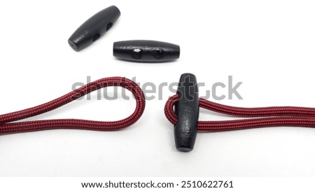 Toggle buttons can be used as clothing buttons, ropes, tents, sports  and hooks in the marine or fishing world. Here's how to use them. isolated on white