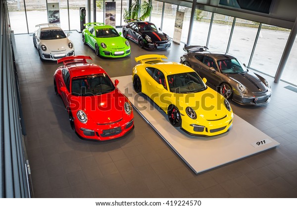 TOGLIATTI, RUSSIA - APRIL 11,
2015: Porsche GT 3 in showroom Primjera as a Volkswagen dealer in
SAMARA region of Russia. Six GT3 different color cars in one show
room