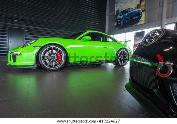 TOGLIATTI, RUSSIA - APRIL 11,\
2015: Porsche GT 3 in showroom Primjera as a Volkswagen dealer in\
SAMARA region of Russia. Six GT3 different color cars in one show\
room