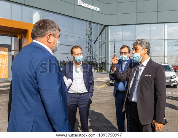 Togliatti, Russia - September 14, 2020: Report\
of official visit CEO of Renault Luca de Meo, CEO of AVTOVAZ Yves\
Caracatzanis and  Marketing Director of AVTOVAZ Olivier Mornet in\
new LADA dealership