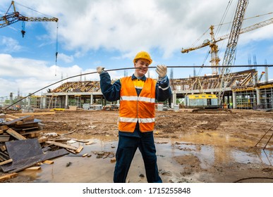 Togliatti, Samara Oblast / Russia - June 16, 2011: Portrait of construction worker who build the objects in construction sites. Production of reinforcement cages for formwork - Shutterstock ID 1715255848