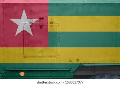 Togo Flag Depicted On Side Part Of Military Armored Truck Closeup. Army Forces Conceptual Background