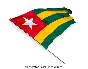 Togo's flag is isolated on a white background. flag symbols of Togo. close up of a Togolese flag waving in the wind.