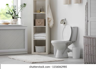Toilet bowl in modern bathroom interior