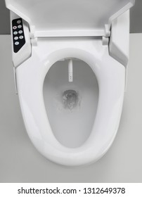 Toilet with electronic high technology. White toilet bowl. Japan toilet electronic control bidet.
