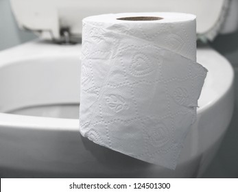 toilet paper on a toilet, concept for constipation and bowel movement